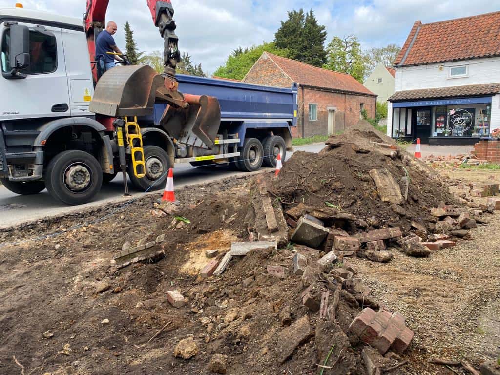 This is a photo of a dig out being carried out for the installation of a new tarmac driveway. Works being carried out by Olney Driveways