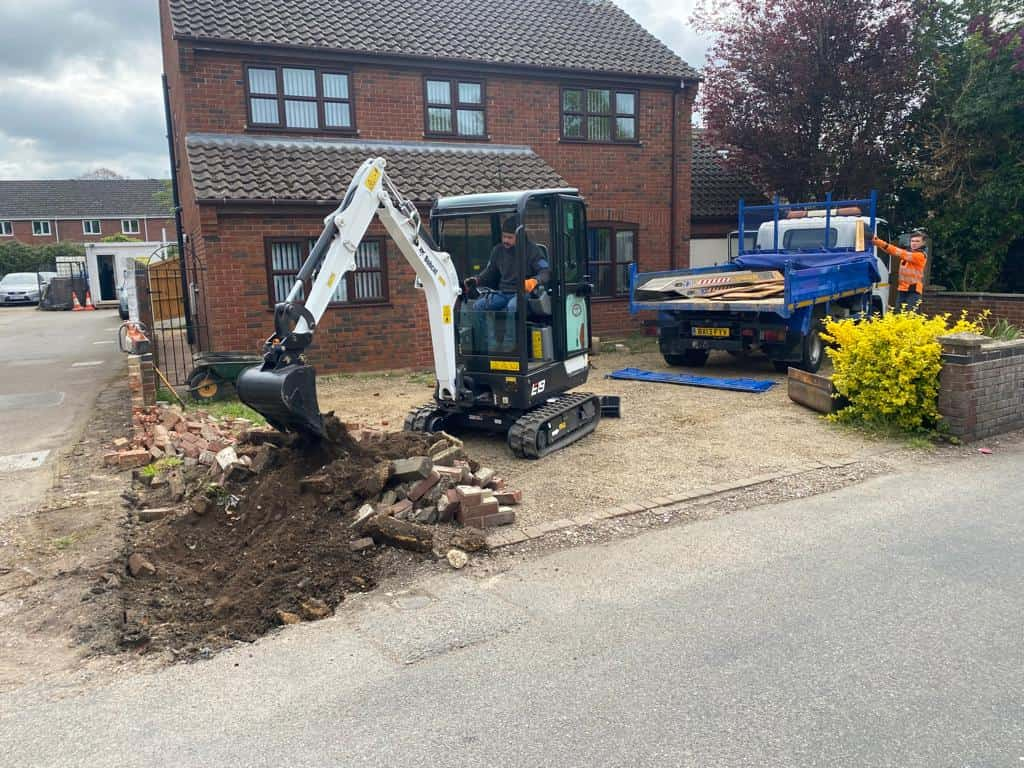 This is a photo of an operative of Olney Driveways Digging out for a new tarmac driveway